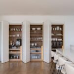 Modern kitchen pantry with organized shelves and appliances